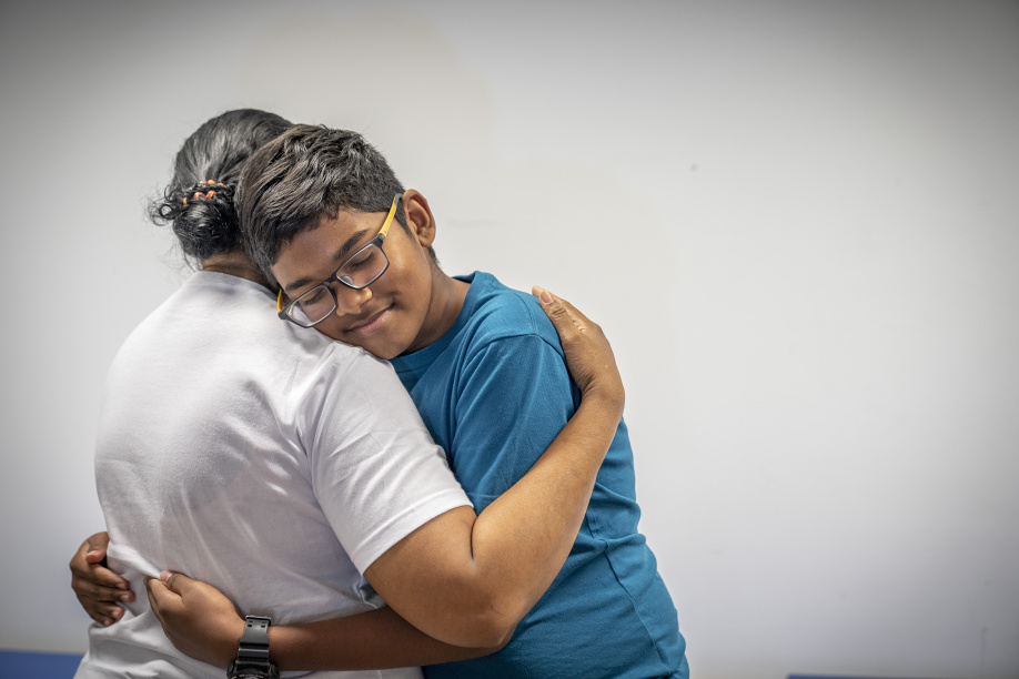 Show thumbnail preview A man and woman, dedicated to helping ex-offenders find jobs, embrace each other in a classroom setting. A man and woman, dedicated to helping ex-offenders find jobs, embrace each other